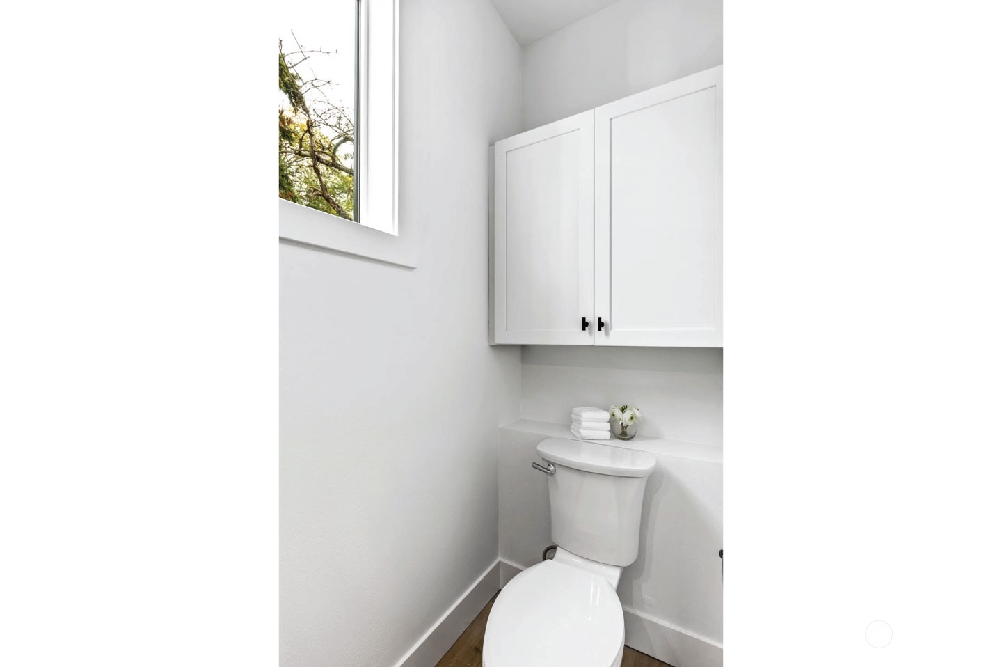 533 North 71st Street, Unit B Seattle, WA 98103 - Photo 12 of 23 a white toilet sitting next to a bathroom sink