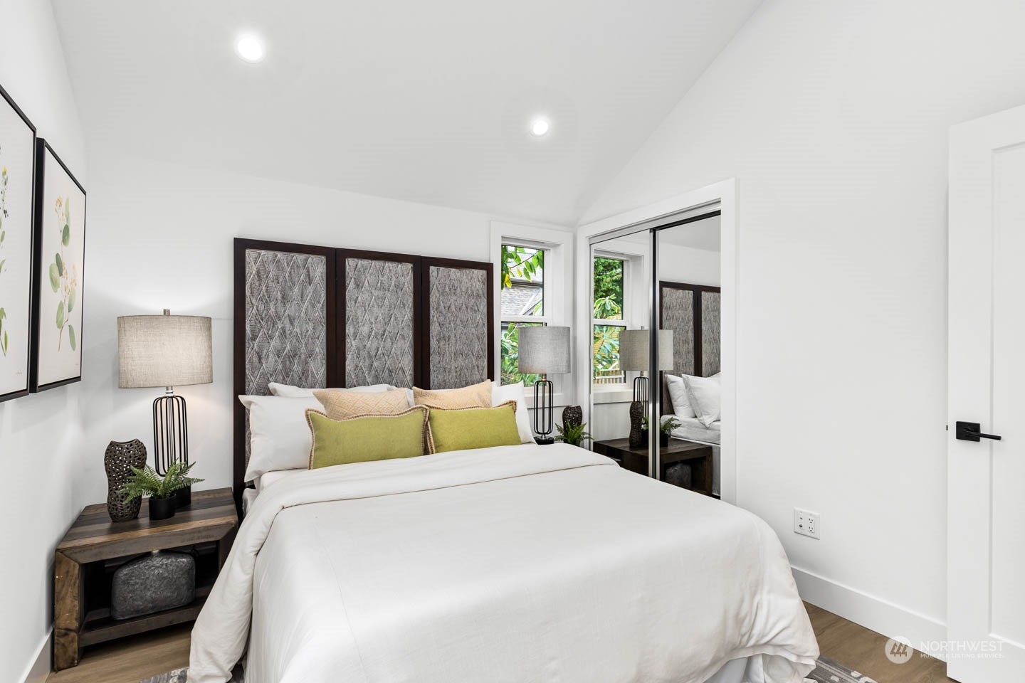 533 North 71st Street, Unit B Seattle, WA 98103 - Photo 19 of 23 a bedroom with a large bed and a lamp