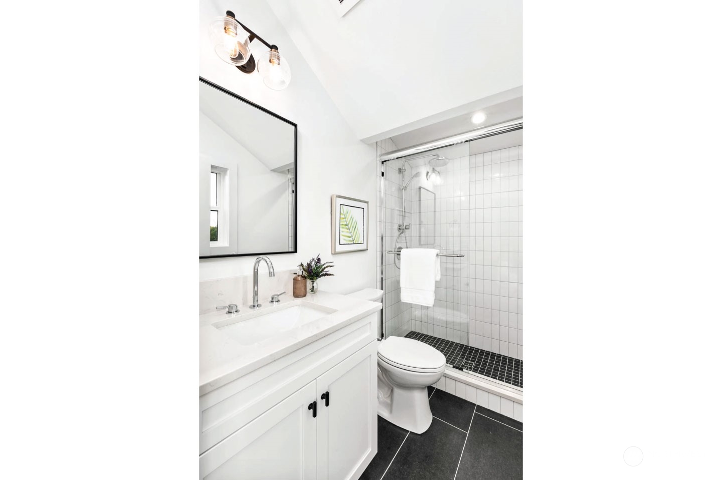 533 North 71st Street, Unit B Seattle, WA 98103 - Photo 21 of 23 a bathroom with a sink a toilet and shower