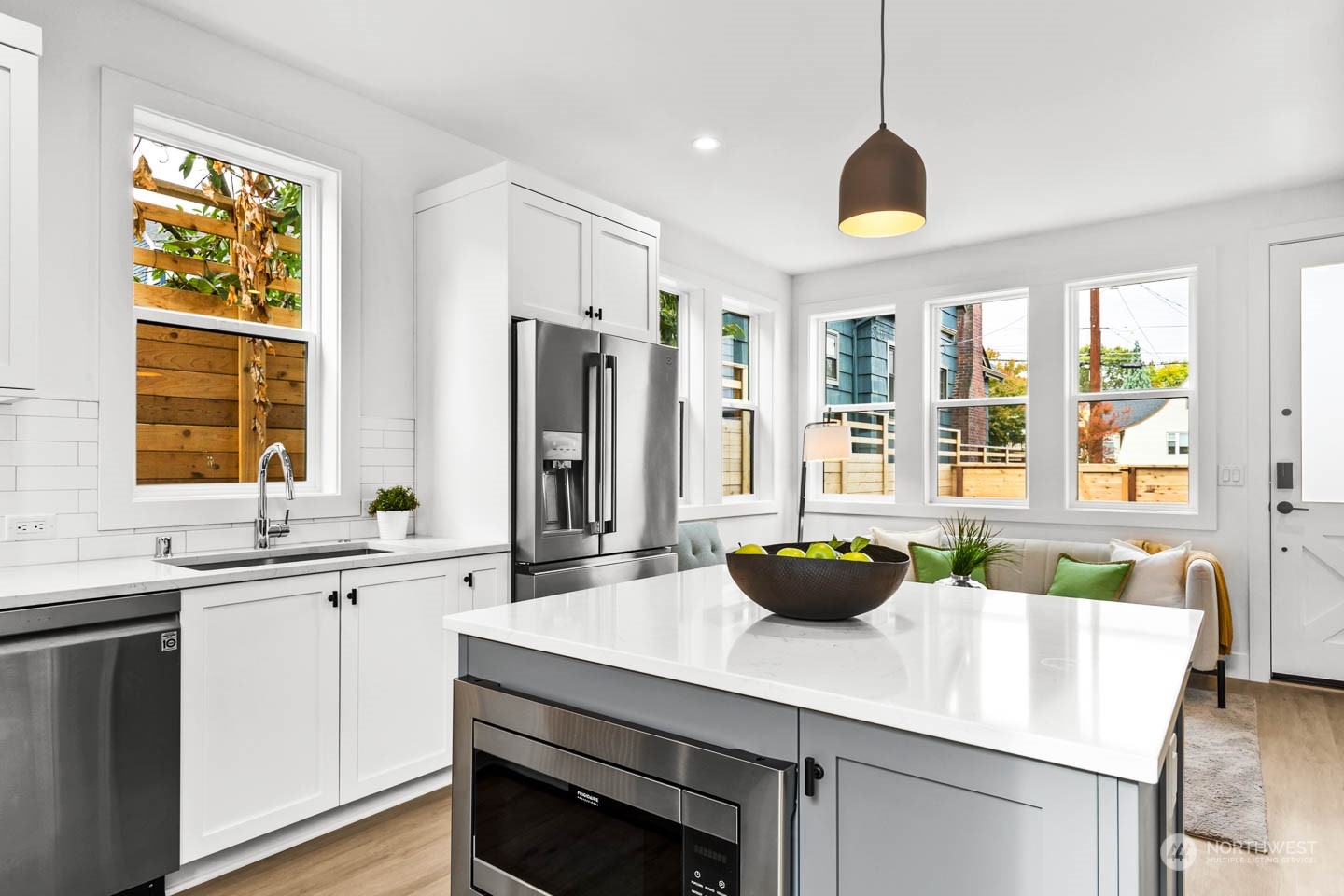 533 North 71st Street, Unit B Seattle, WA 98103 - Photo 7 of 23 a kitchen with a sink a counter top space and stainless steel appliances