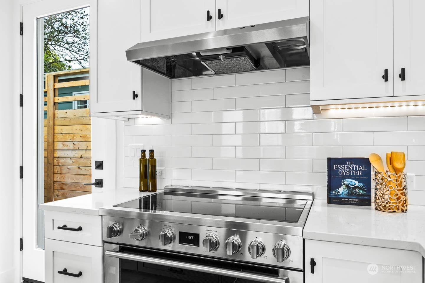 533 North 71st Street, Unit B Seattle, WA 98103 - Photo 8 of 23 a stove top oven sitting inside of a kitchen
