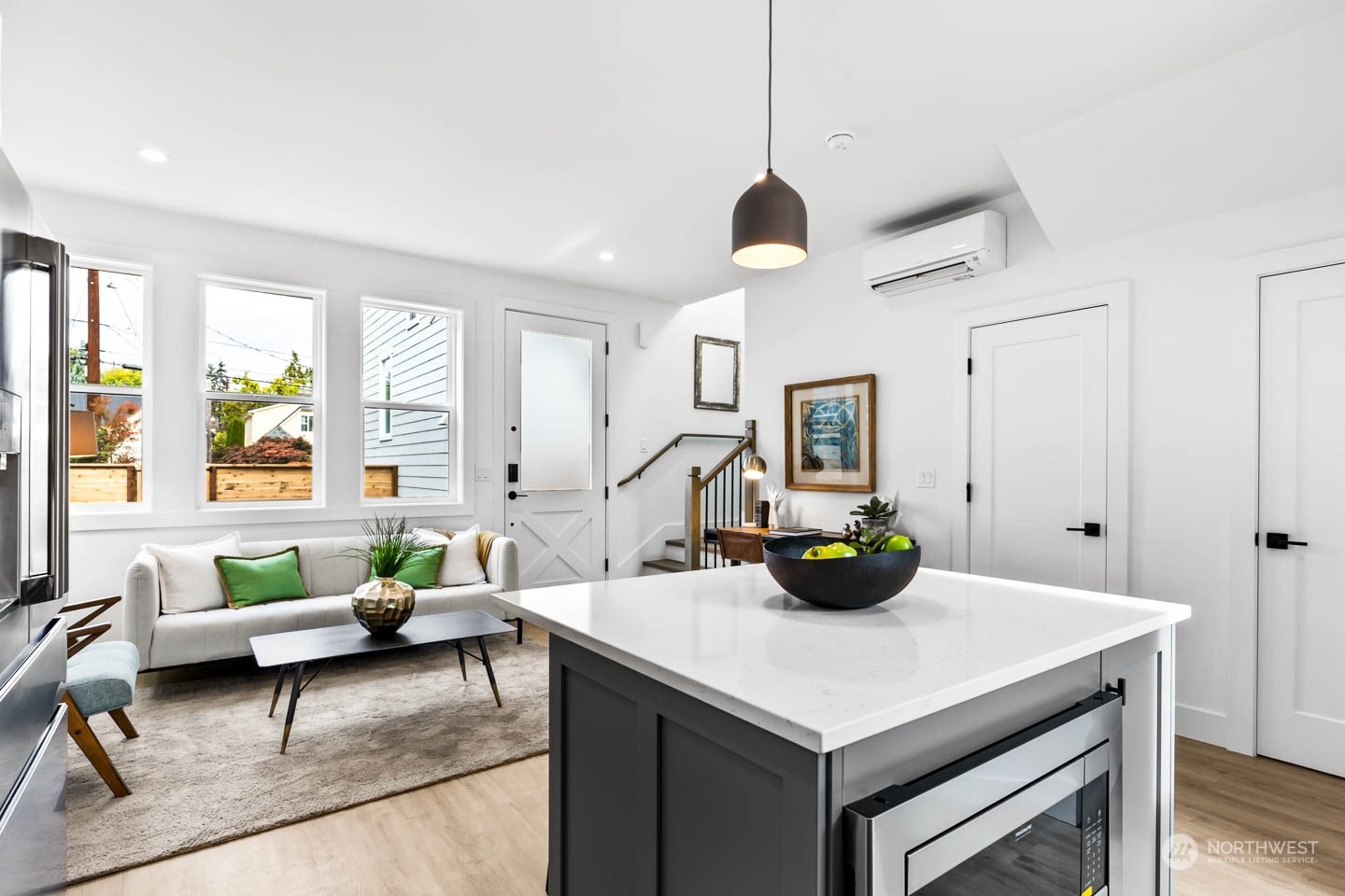 533 North 71st Street, Unit B Seattle, WA 98103 - Photo 9 of 23 a kitchen with a sink a counter space and a dining table