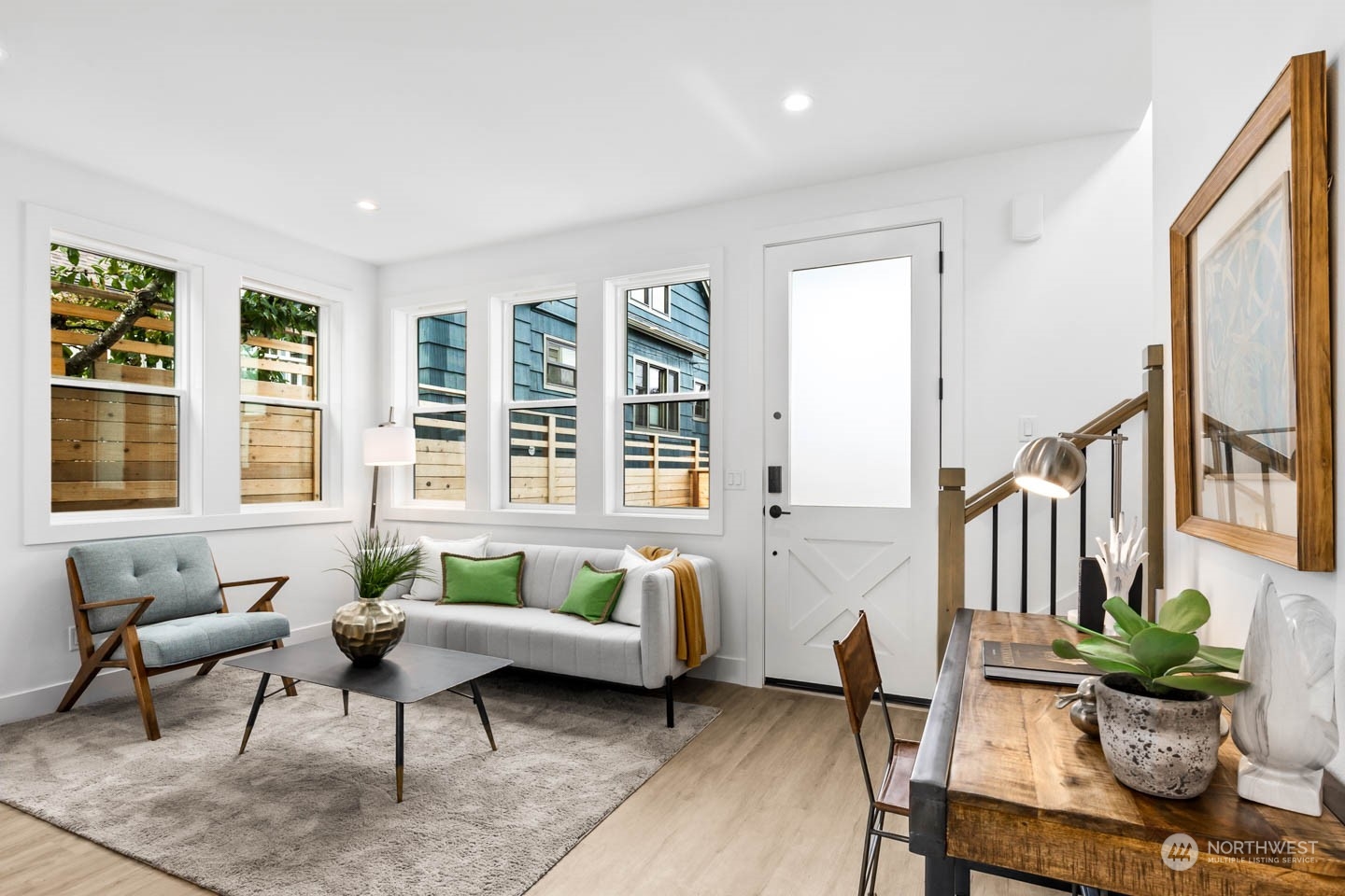 533 North 71st Street, Unit B Seattle, WA 98103 - Photo 10 of 23 a living room with furniture floor to ceiling window and wooden floor