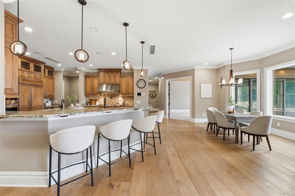855 Southeast 87th Street Ocala, FL 34480 - Photo 16 of 79 a large kitchen with a table and chairs