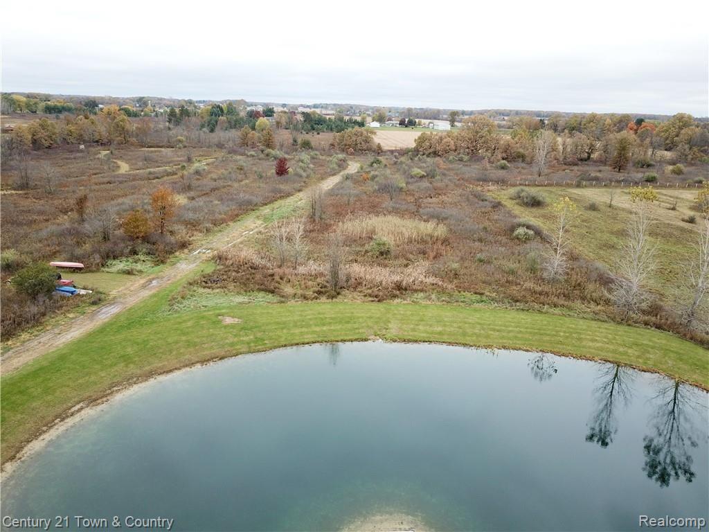 10352 Weber Road Columbus, MI 48063 - Photo 40 of 46 Pond stocked with fish, trail to back of property