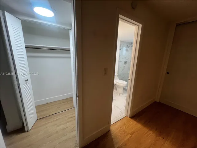 an empty room with wooden floor