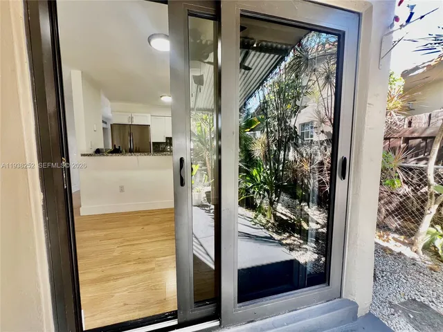 view of living room with a floor to ceiling window and wooden floor
