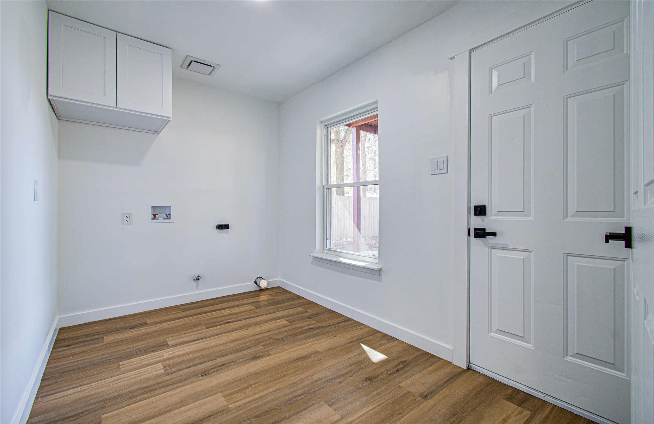 23319 Whispering Willow Drive Spring, TX 77373 - Photo 13 of 41 a view of a room with wooden floor and white walls