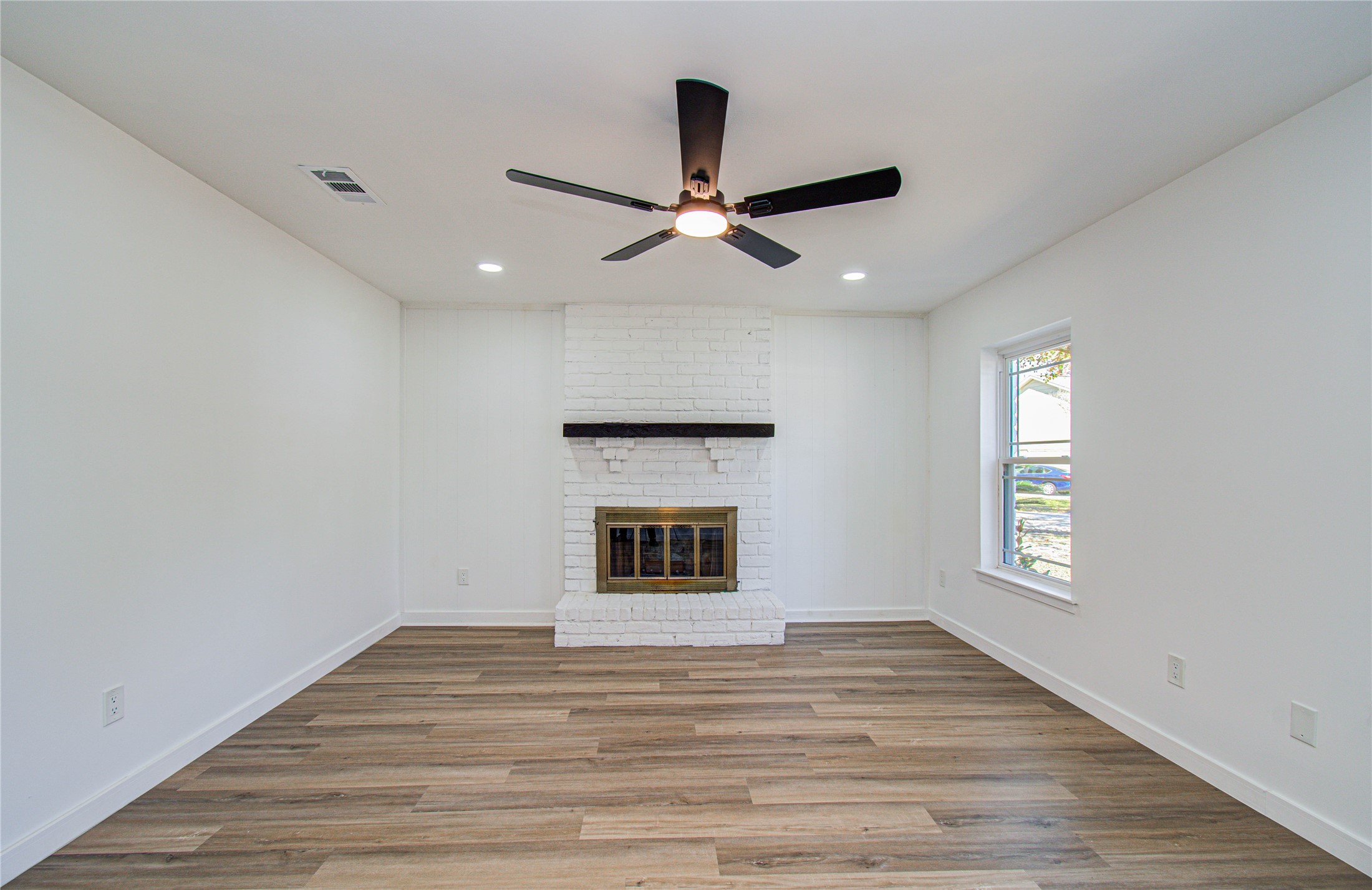 23319 Whispering Willow Drive Spring, TX 77373 - Photo 16 of 41 a view of an empty room with window and wooden floor
