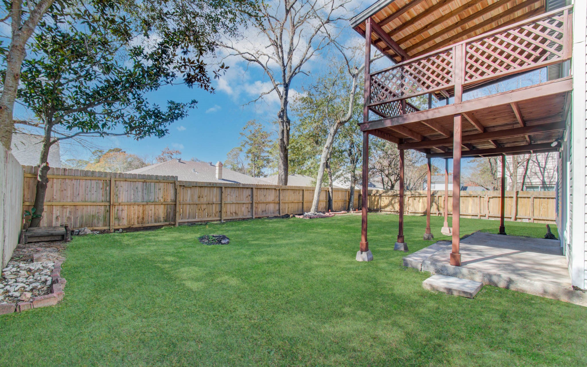 23319 Whispering Willow Drive Spring, TX 77373 - Photo 18 of 41 a view of a backyard with wooden fence