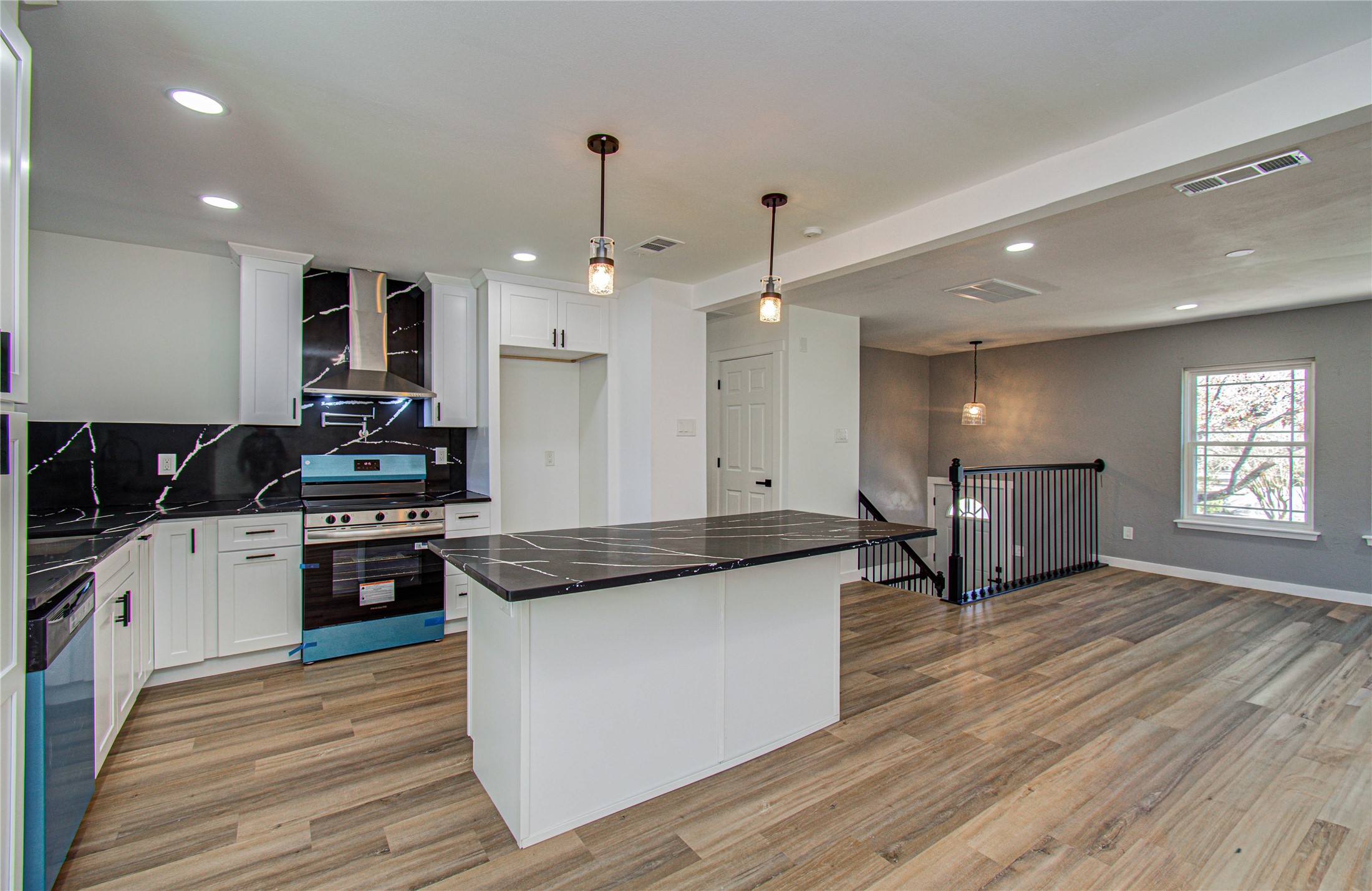 23319 Whispering Willow Drive Spring, TX 77373 - Photo 23 of 41 a large kitchen with stainless steel appliances granite countertop a stove a sink and a refrigerator