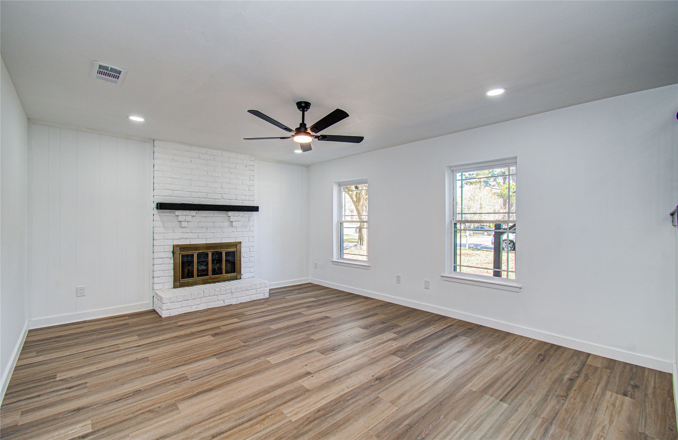 23319 Whispering Willow Drive Spring, TX 77373 - Photo 28 of 41 an empty room with windows and fireplace