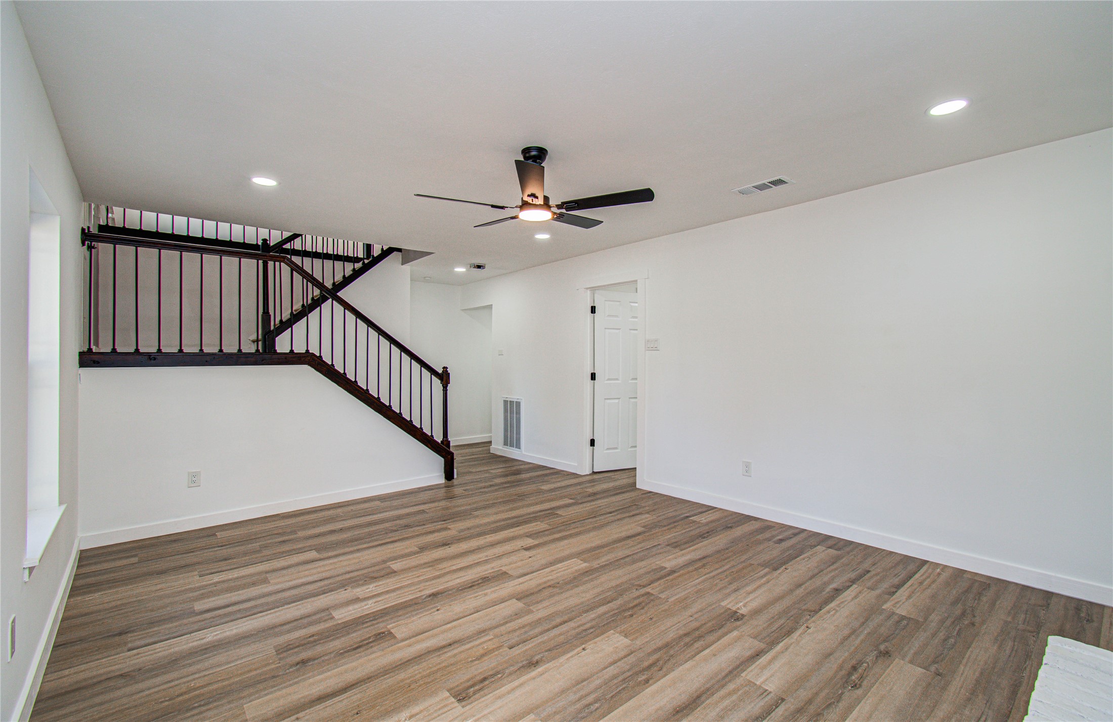 23319 Whispering Willow Drive Spring, TX 77373 - Photo 33 of 41 a view of a room with wooden floor and ceiling fan