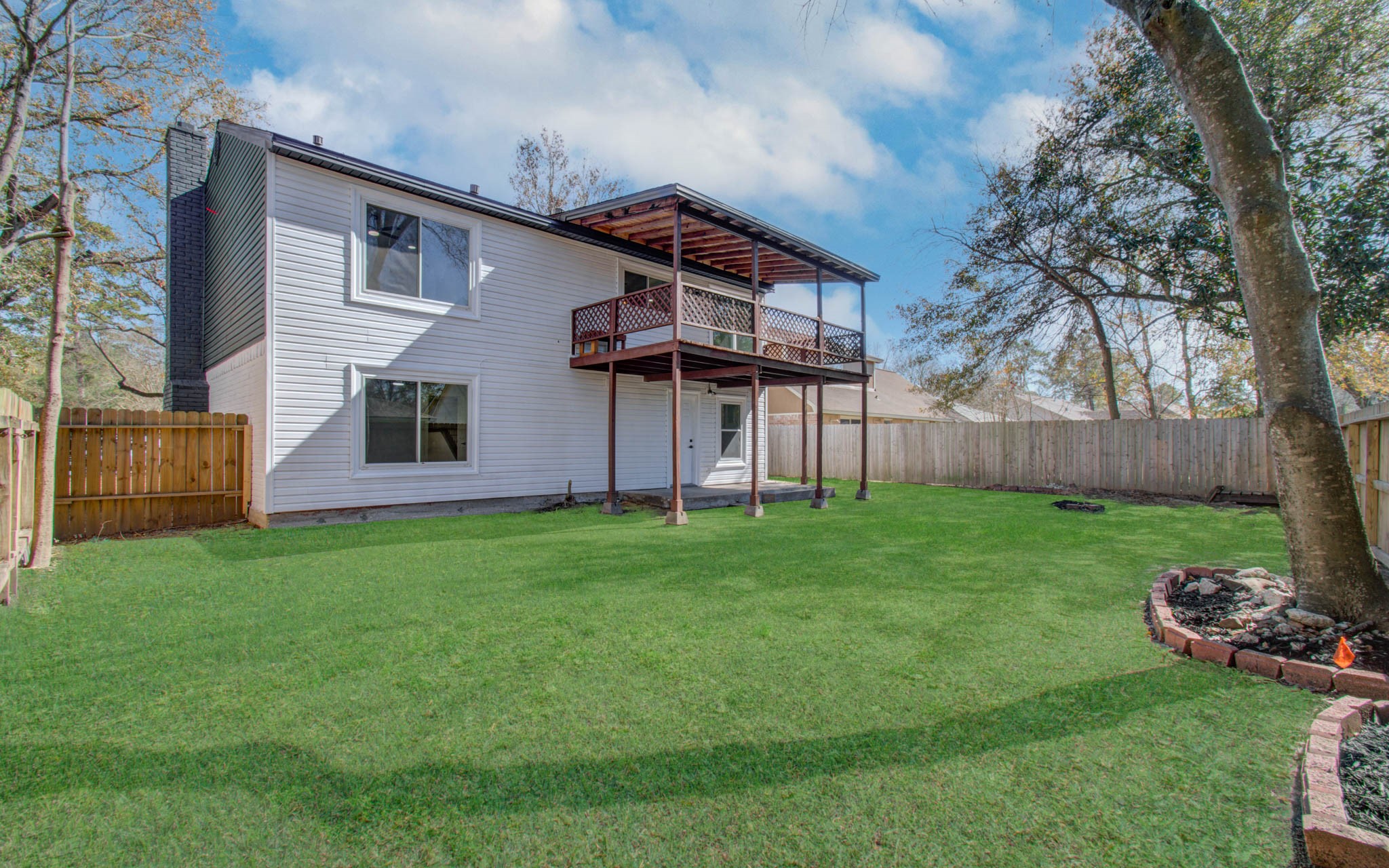 23319 Whispering Willow Drive Spring, TX 77373 - Photo 36 of 41 a backyard of a house with lots of green space
