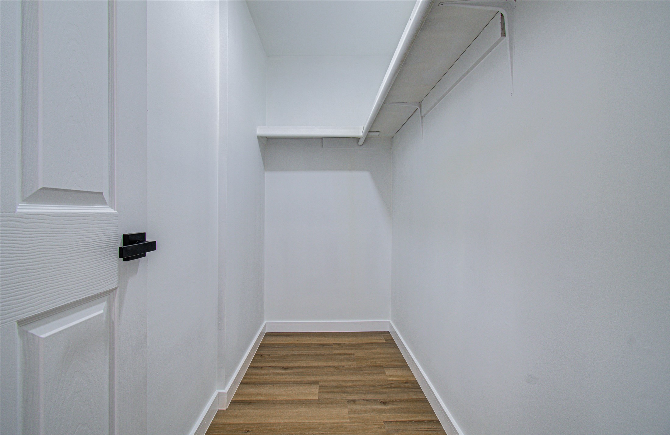 23319 Whispering Willow Drive Spring, TX 77373 - Photo 40 of 41 a view of a hallway with wooden floor and staircase