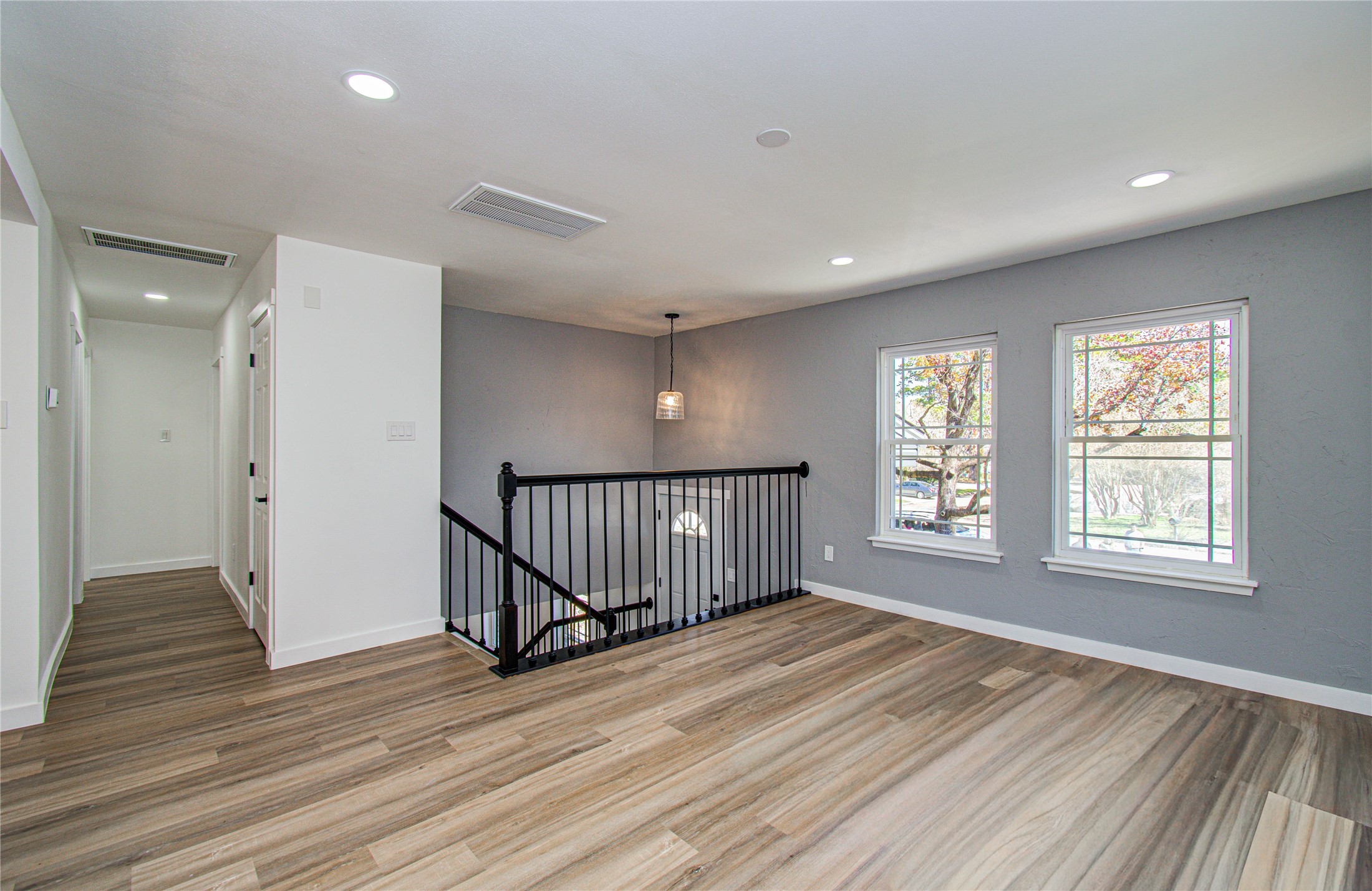23319 Whispering Willow Drive Spring, TX 77373 - Photo 5 of 41 an empty room with wooden floor and windows