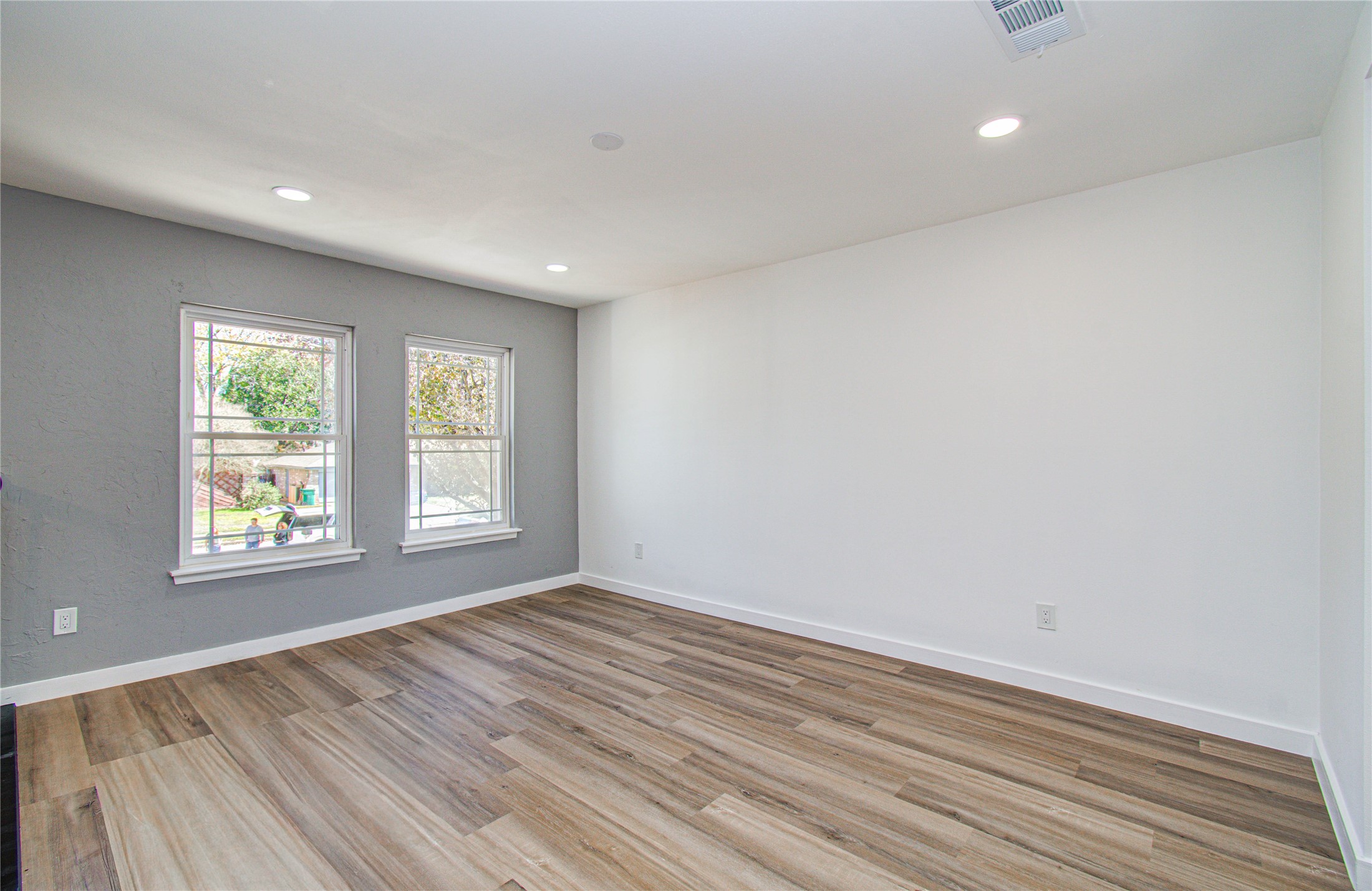 23319 Whispering Willow Drive Spring, TX 77373 - Photo 7 of 41 wooden floor in an empty room with a window