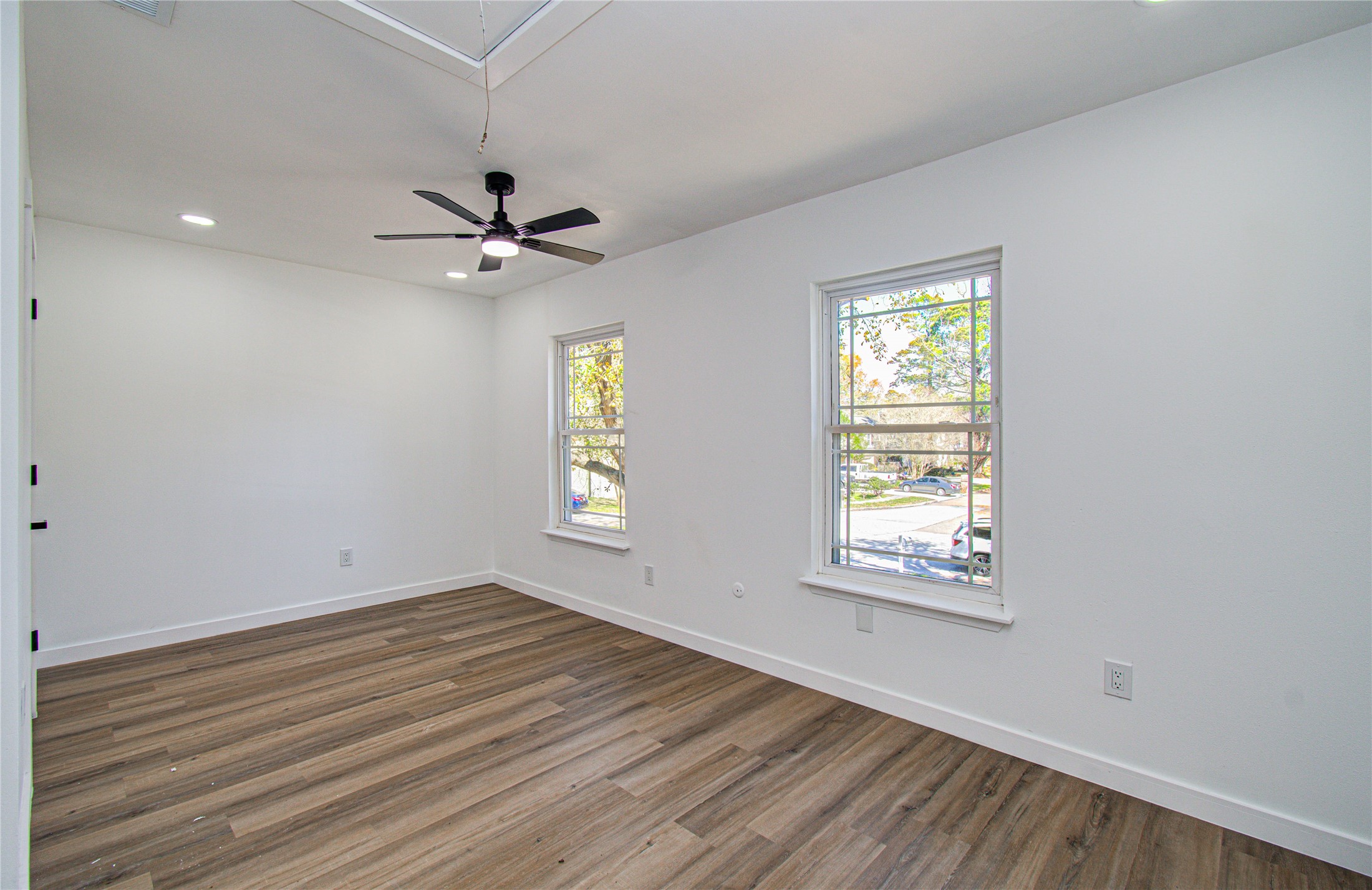 23319 Whispering Willow Drive Spring, TX 77373 - Photo 10 of 41 a view of an empty room with a window and wooden floor