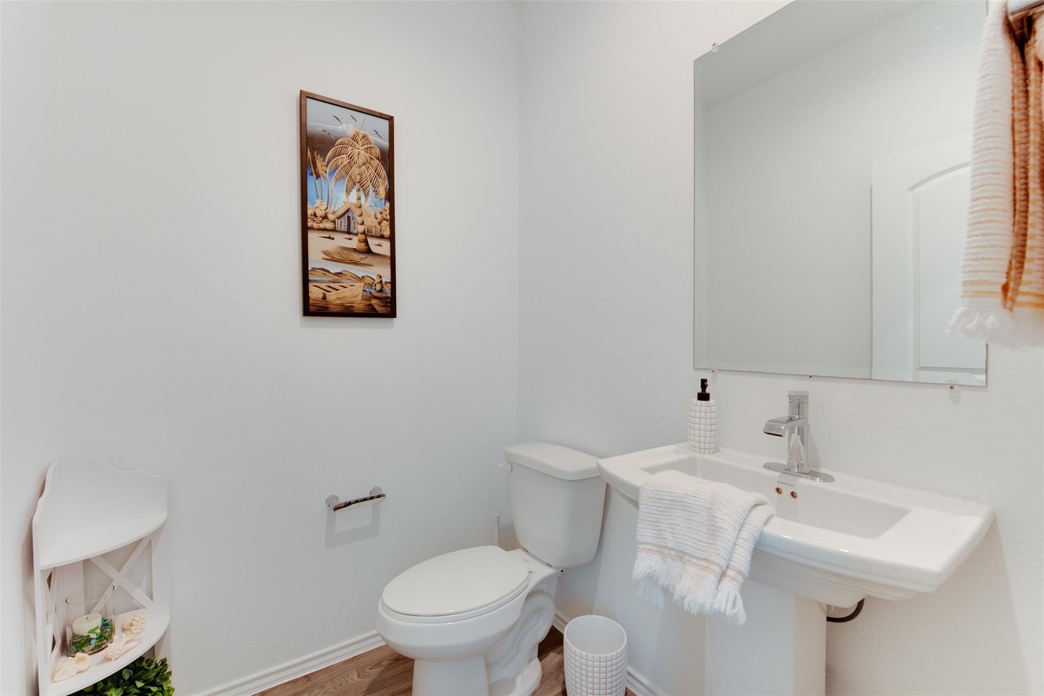5339 Tuscany Hills Lane Spring, TX 77373 - Photo 18 of 28 a bathroom with a sink mirror and toilet