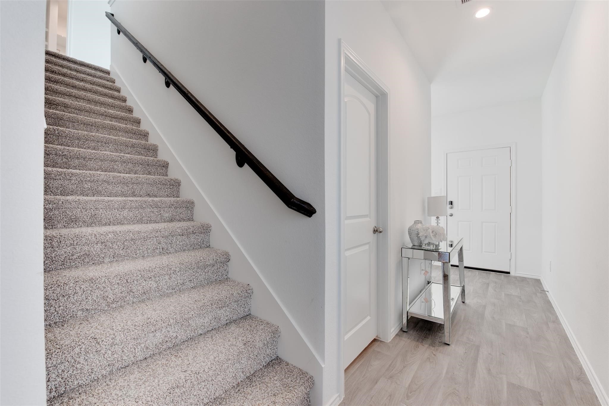 5339 Tuscany Hills Lane Spring, TX 77373 - Photo 20 of 28 a view of entryway and hall with wooden floor