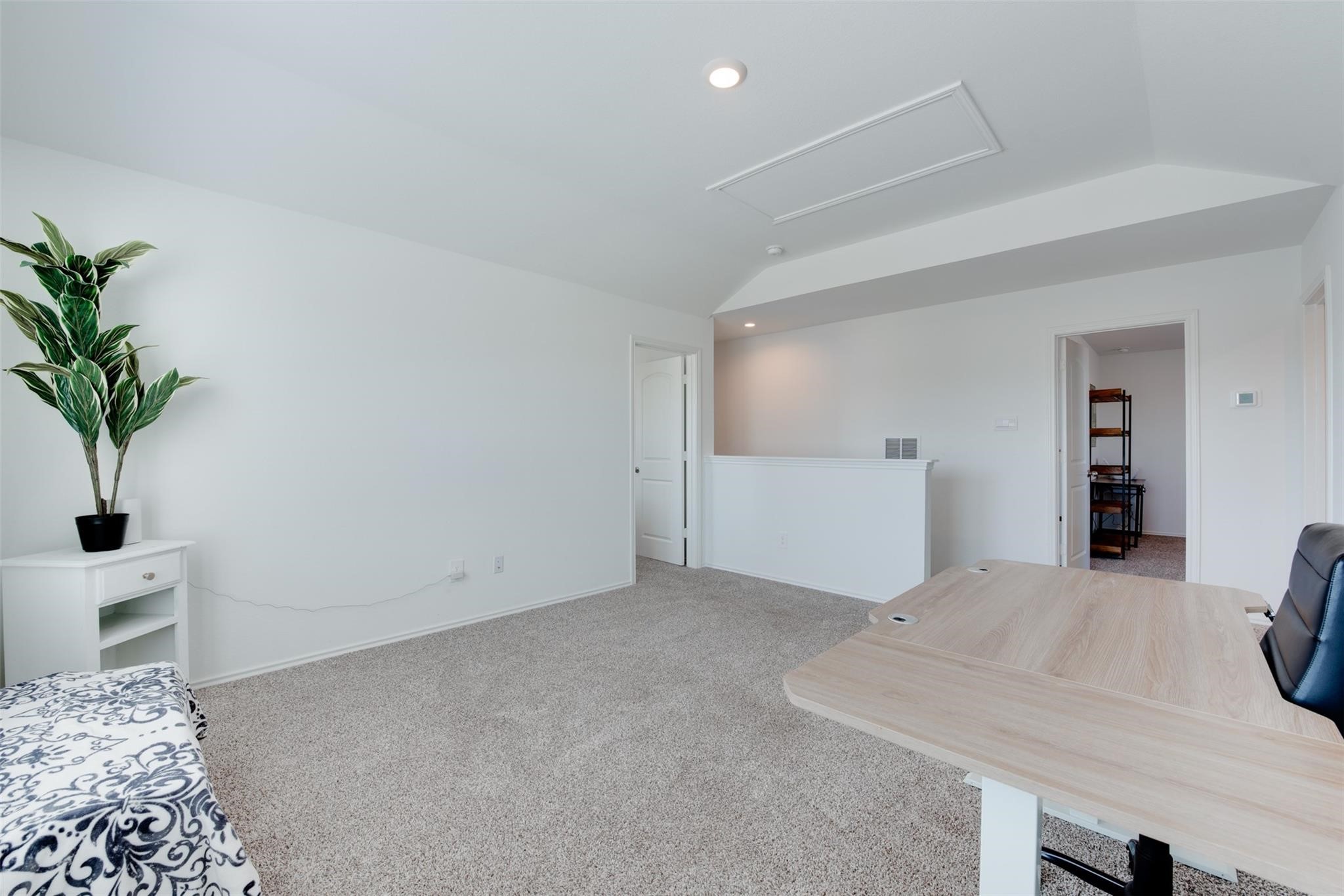 5339 Tuscany Hills Lane Spring, TX 77373 - Photo 23 of 28 a bedroom with a bed and a potted plant on the dresser