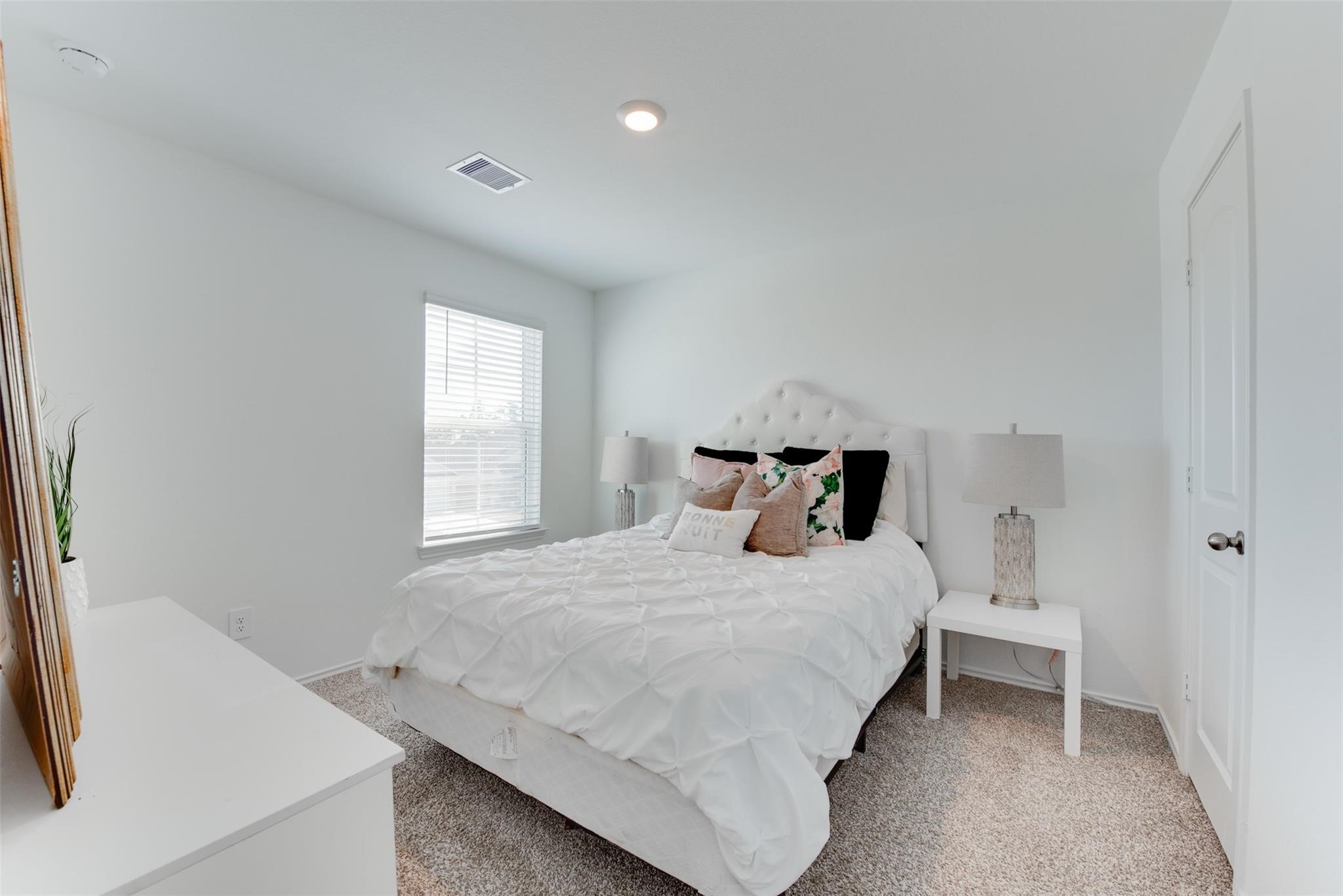 5339 Tuscany Hills Lane Spring, TX 77373 - Photo 24 of 28 a bedroom with a bed and a window