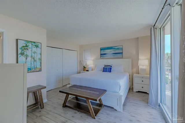 a bedroom with a bed and a table in it