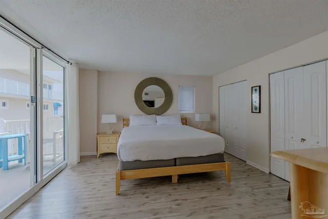 a bedroom with a bed and a closet