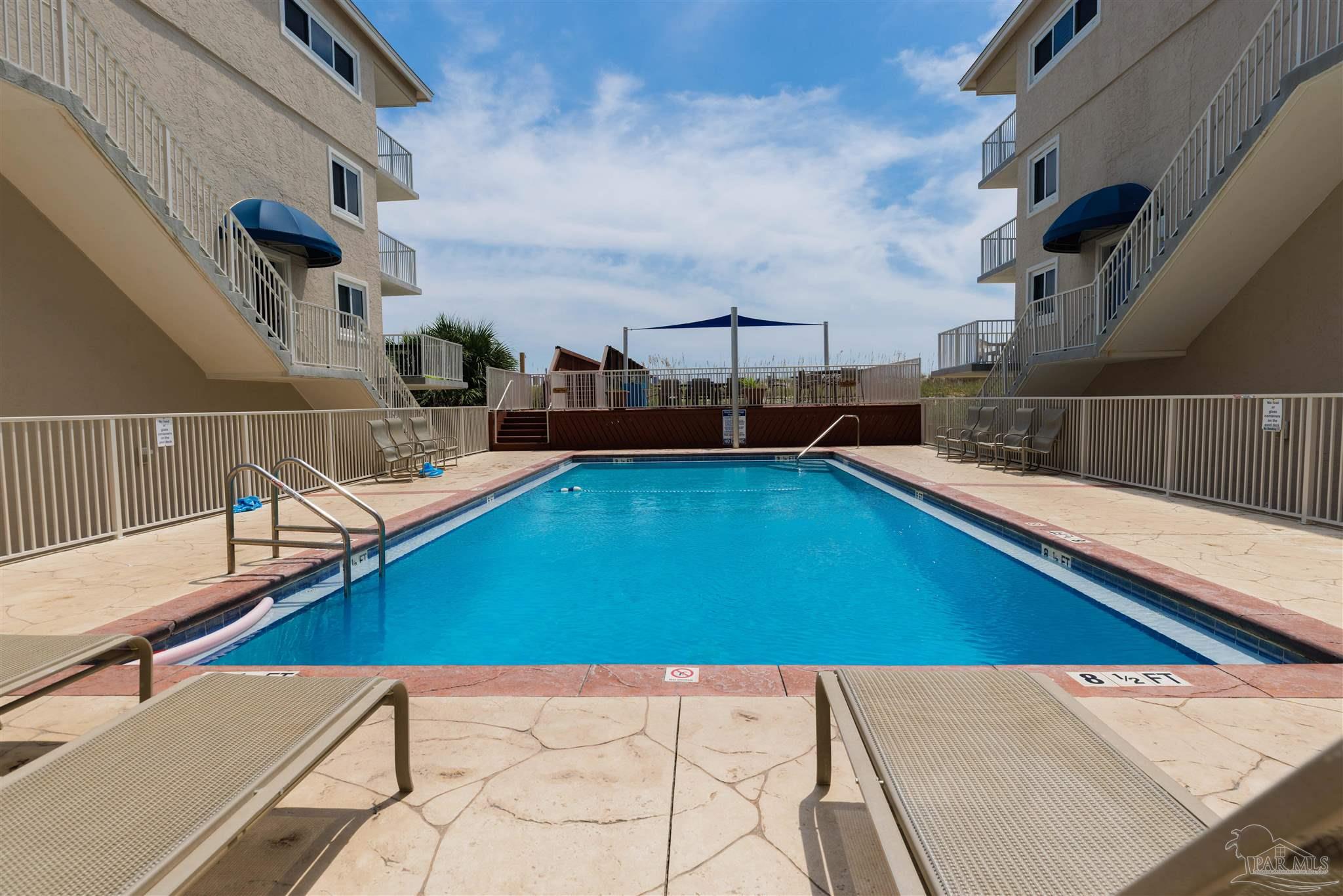 1111 Fort Pickens Road, Unit 312 Pensacola Beach, FL 32561 - Photo 35 of 40 a view of a living room with kitchen furniture