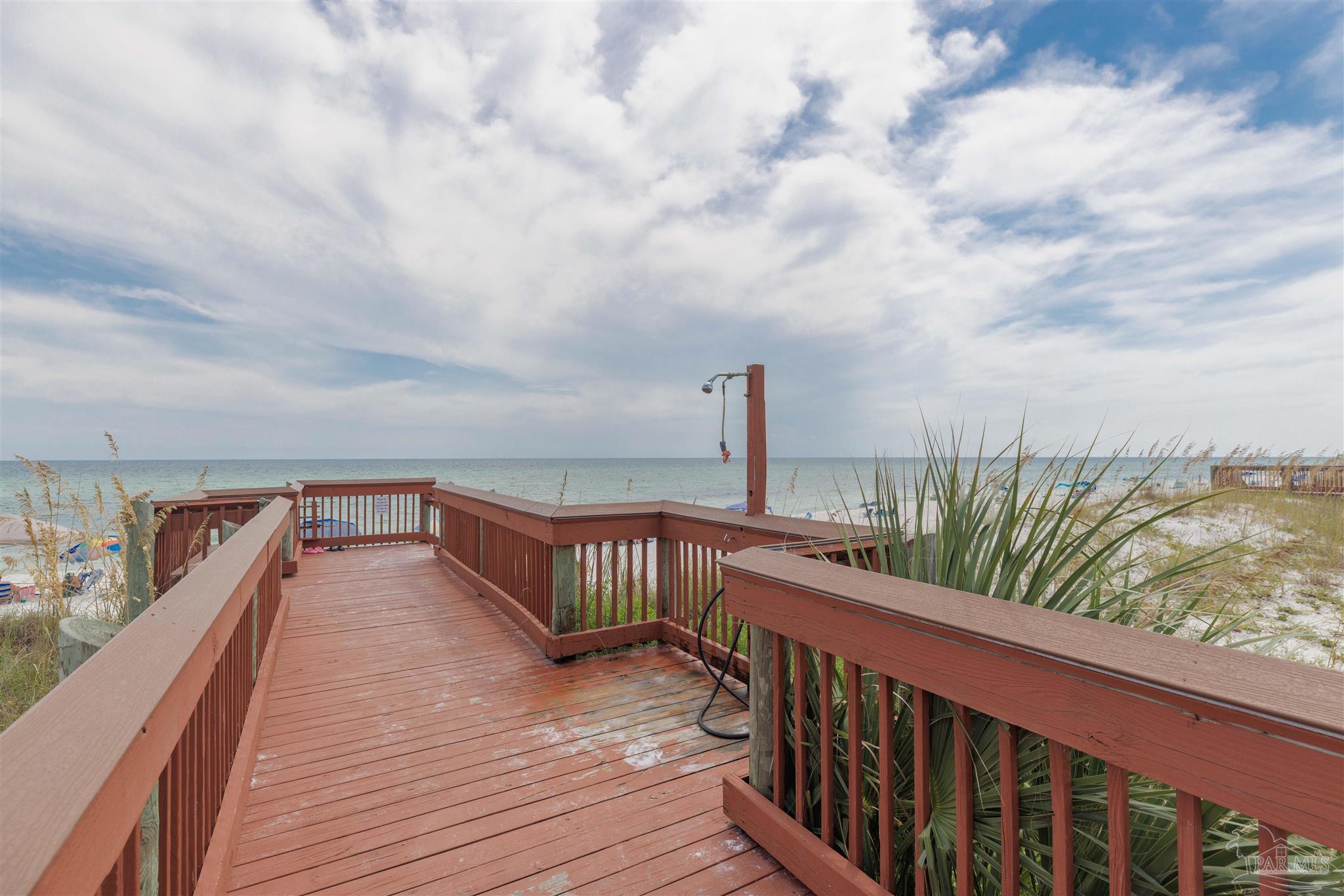 1111 Fort Pickens Road, Unit 312 Pensacola Beach, FL 32561 - Photo 36 of 40 a balcony with wooden floor