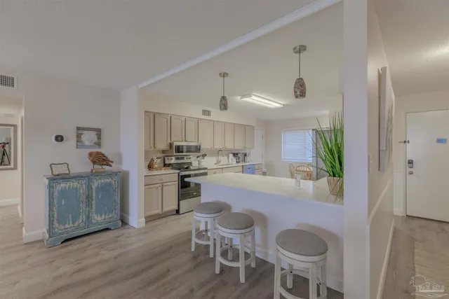 a kitchen with a table and chairs in it