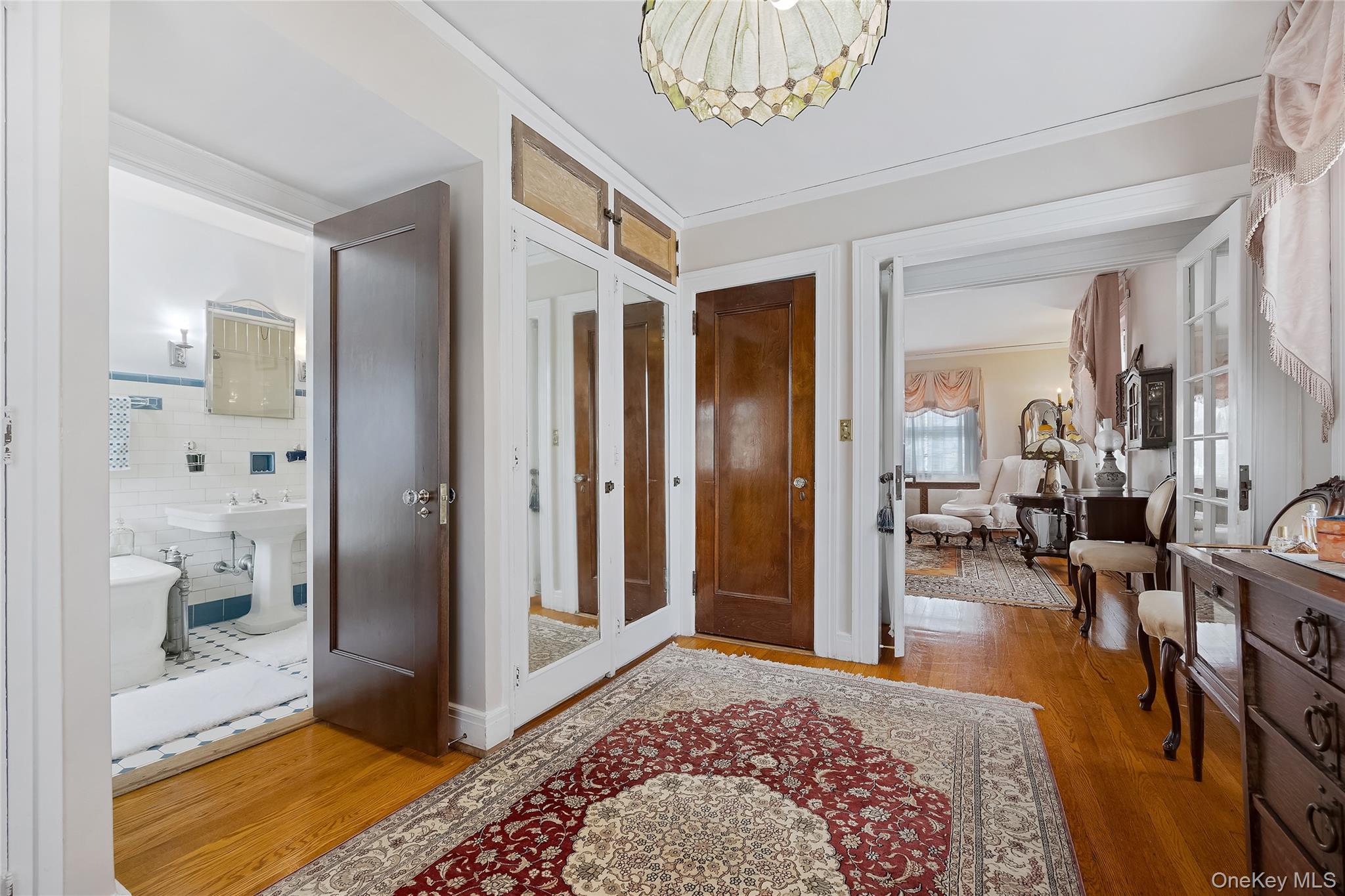 1-27 Beverly Road Queens, NY 11363 - Photo 42 of 46 a bedroom with furniture and a rug