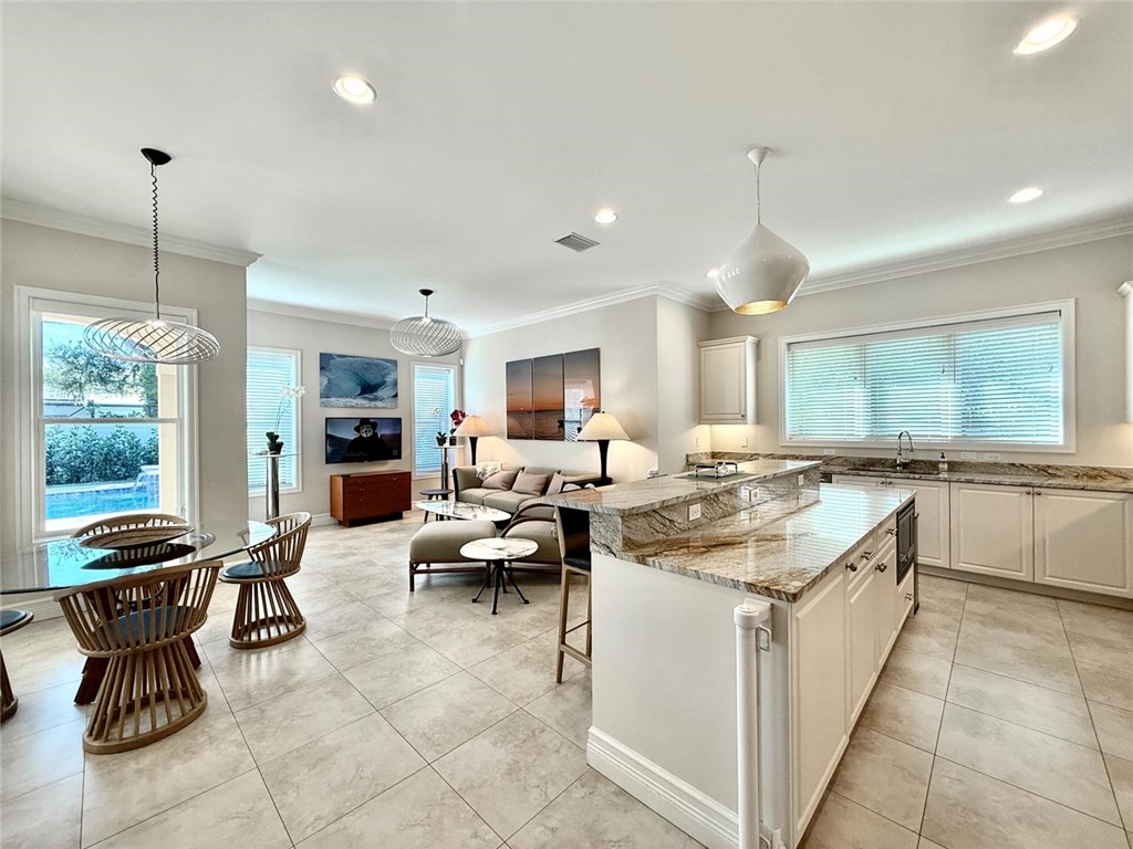 506 Cypress Road Vero Beach, FL 32963 - Photo 11 of 35 a kitchen with stainless steel appliances granite countertop a stove and more cabinets
