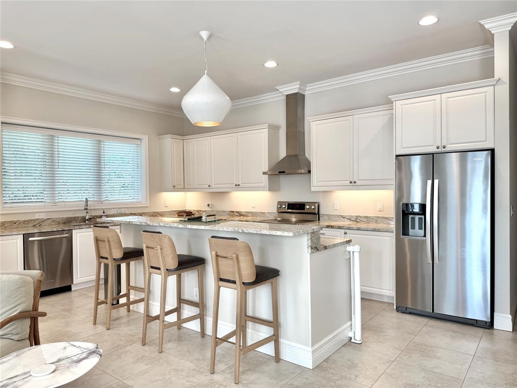 506 Cypress Road Vero Beach, FL 32963 - Photo 15 of 35 a kitchen with appliances a sink and cabinets