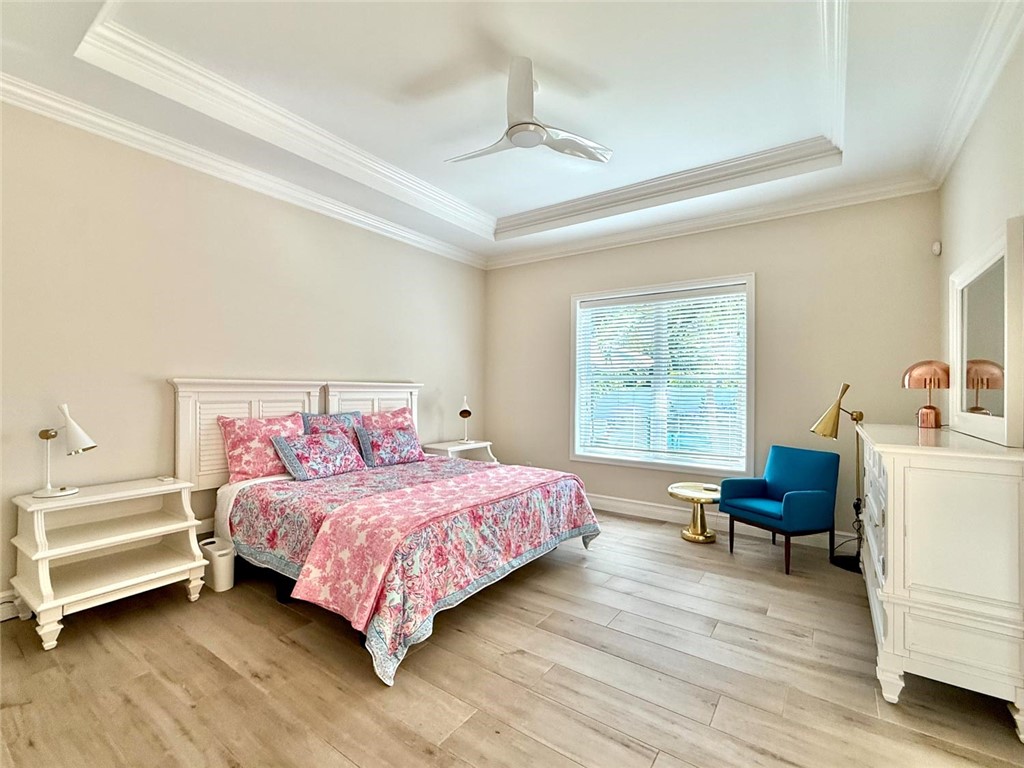 506 Cypress Road Vero Beach, FL 32963 - Photo 17 of 35 a bedroom with a bed and a chair