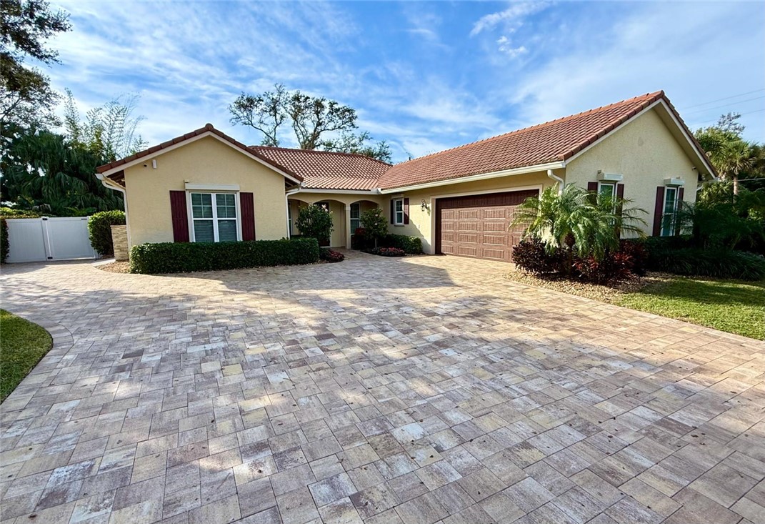 506 Cypress Road Vero Beach, FL 32963 - Photo 2 of 35 a view of a house with a yard