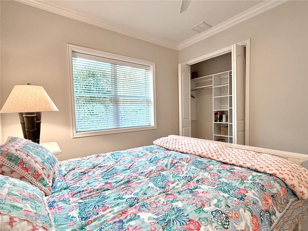 506 Cypress Road Vero Beach, FL 32963 - Photo 24 of 35 a bedroom with a bed and a window