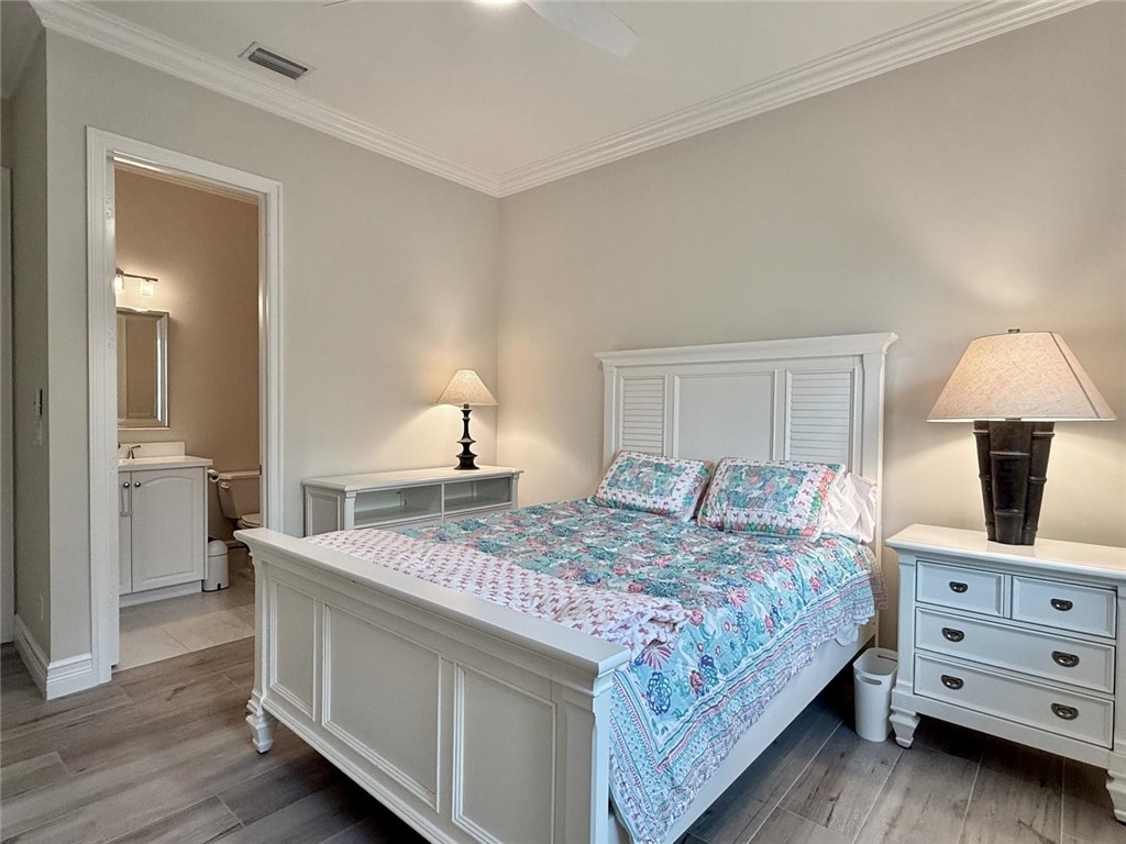 506 Cypress Road Vero Beach, FL 32963 - Photo 25 of 35 a bedroom with a bed and a table in it