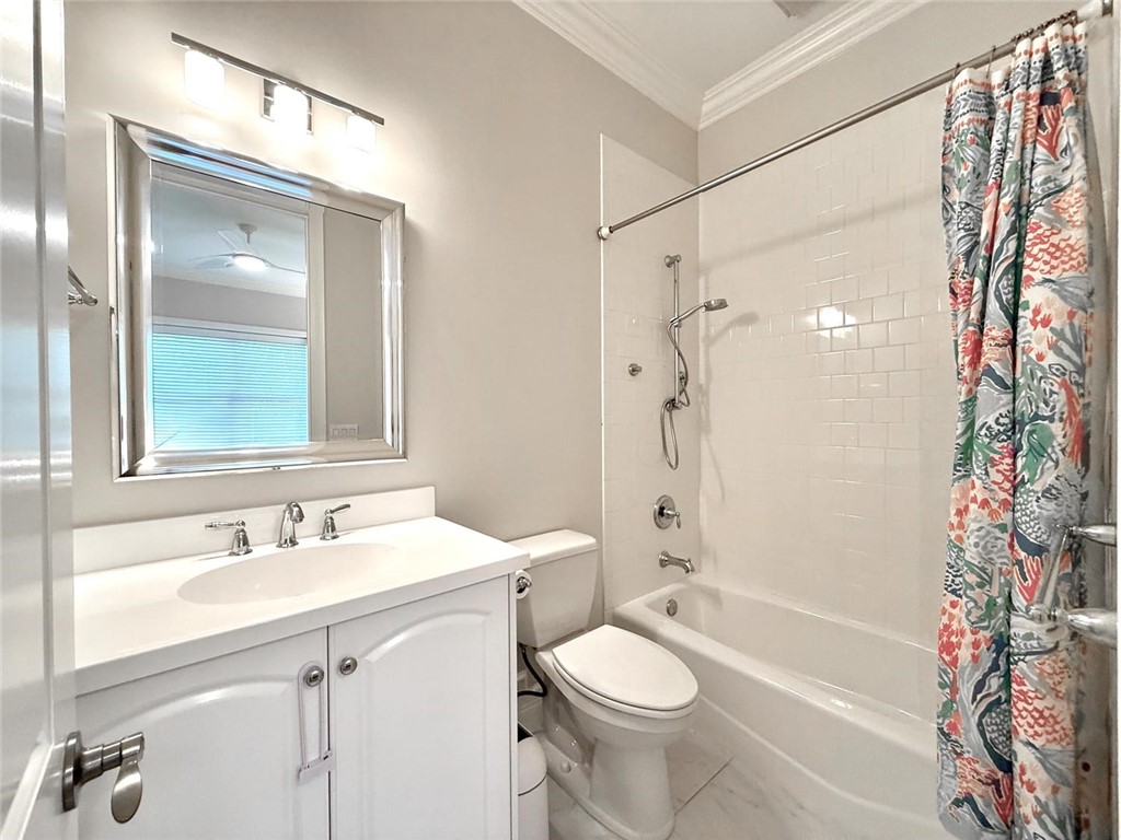 506 Cypress Road Vero Beach, FL 32963 - Photo 26 of 35 a bathroom with a sink a toilet and shower
