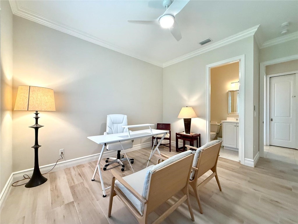 506 Cypress Road Vero Beach, FL 32963 - Photo 27 of 35 a view of a workspace with furniture and wooden floor