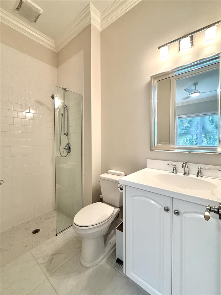 506 Cypress Road Vero Beach, FL 32963 - Photo 28 of 35 a bathroom with a sink toilet and shower