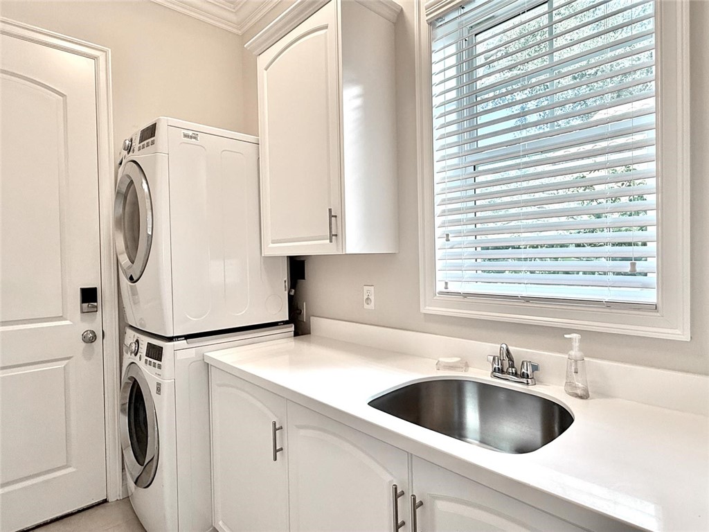 506 Cypress Road Vero Beach, FL 32963 - Photo 29 of 35 a view of a kitchen with sink washer and dryer