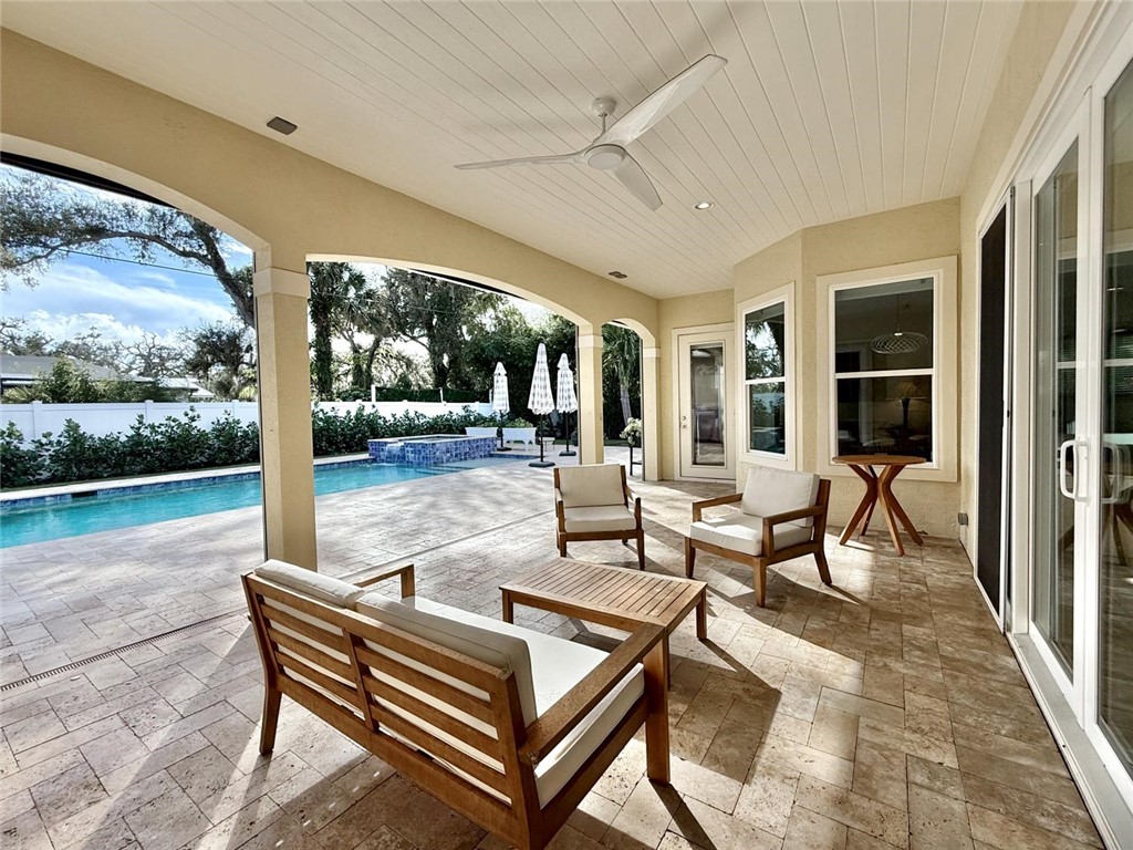 506 Cypress Road Vero Beach, FL 32963 - Photo 30 of 35 a building outdoor space with patio furniture and potted plants