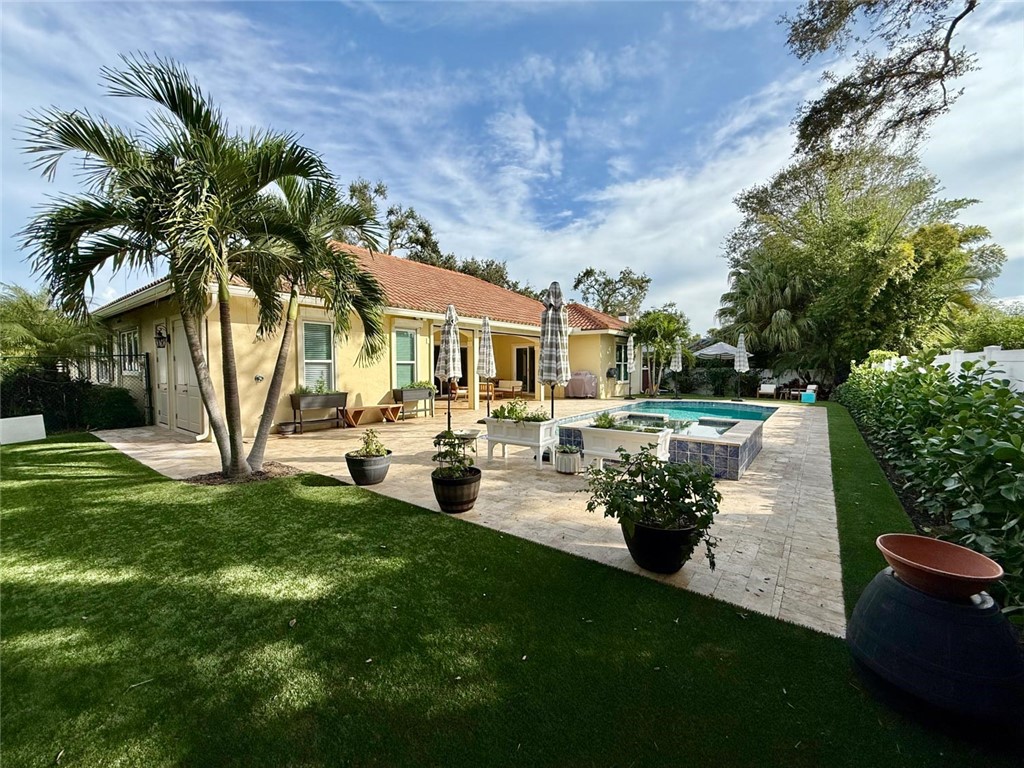 506 Cypress Road Vero Beach, FL 32963 - Photo 31 of 35 a view of a yard with plants and large trees