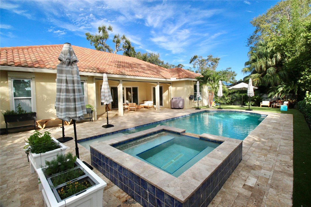506 Cypress Road Vero Beach, FL 32963 - Photo 32 of 35 a view of a house with pool and chairs