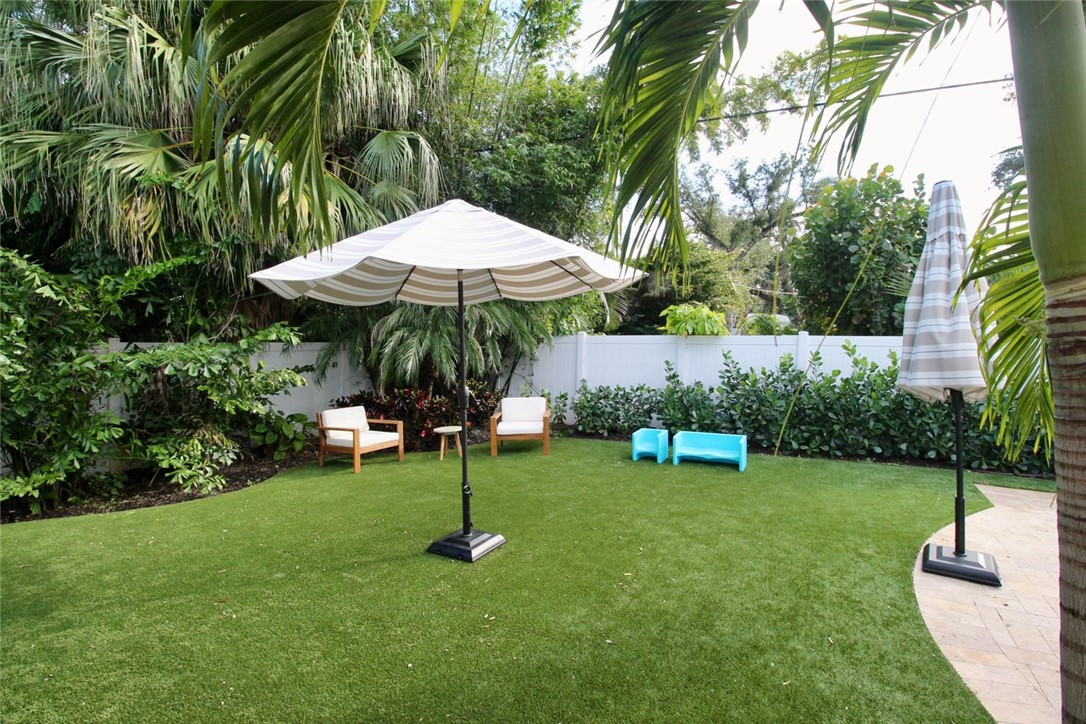 506 Cypress Road Vero Beach, FL 32963 - Photo 33 of 35 a view of outdoor space with a garden and trees