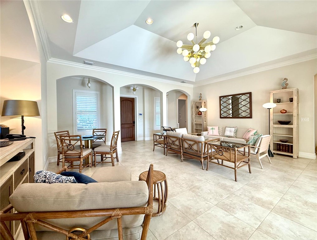 506 Cypress Road Vero Beach, FL 32963 - Photo 7 of 35 a living room with furniture a chandelier and a chandelier