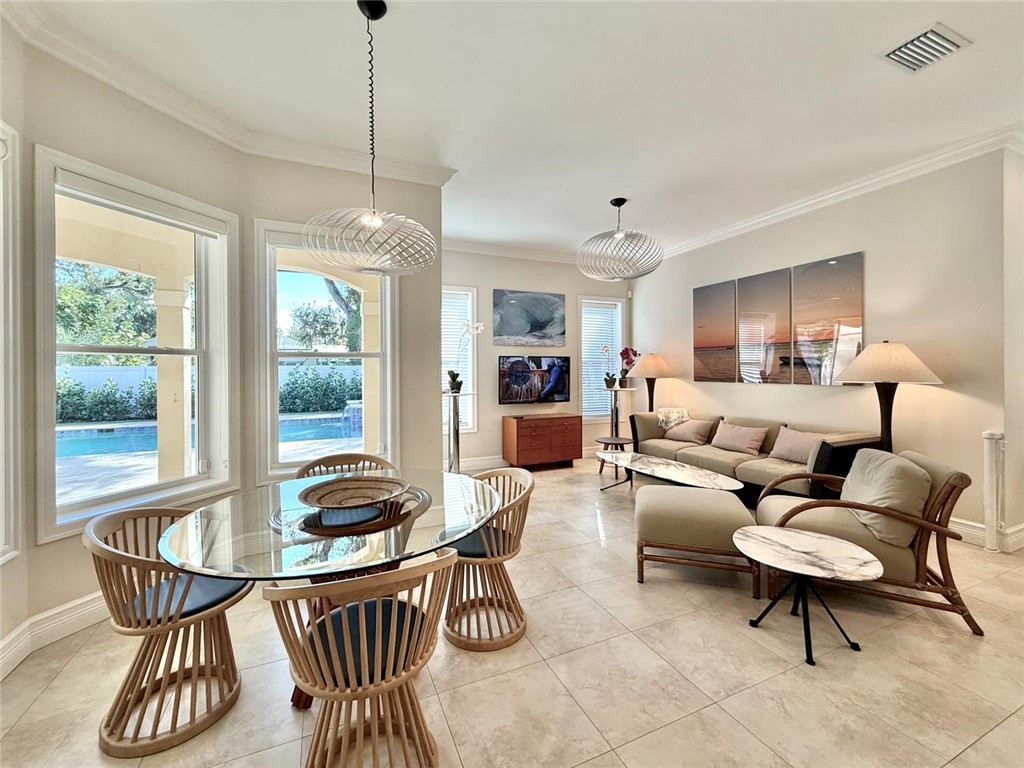 506 Cypress Road Vero Beach, FL 32963 - Photo 8 of 35 a living room with furniture and a large window