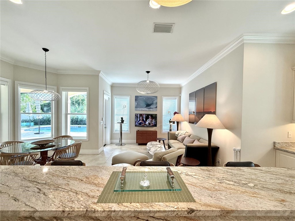506 Cypress Road Vero Beach, FL 32963 - Photo 9 of 35 a living room with furniture window and a table
