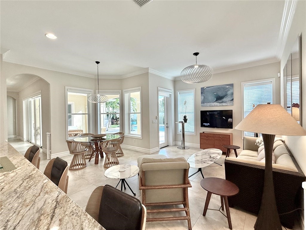 506 Cypress Road Vero Beach, FL 32963 - Photo 10 of 35 a living room with furniture and a large window